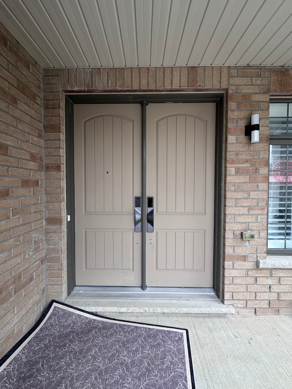 v5 gray and dummy installed on a residential door in a North American home