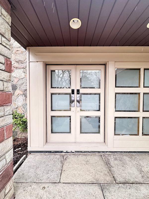 v5 gray and dummy installed on a residential door in a North American home
