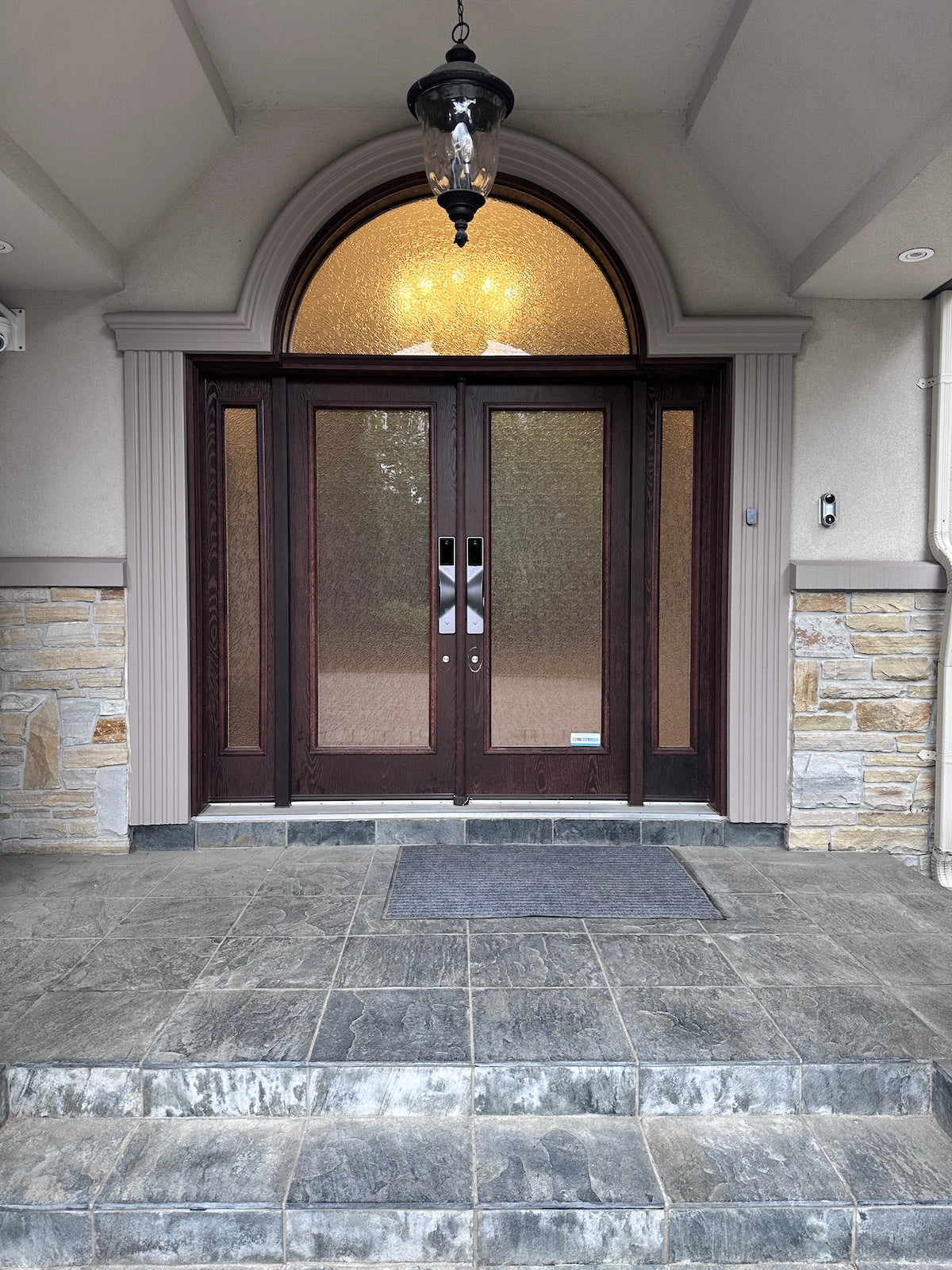v5 gray and dummy installed on a residential door in a North American home